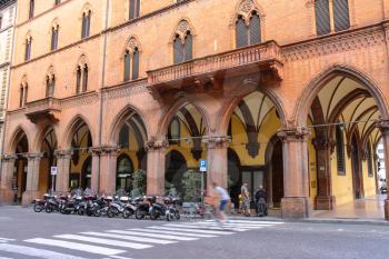 Bologna, Italy - August 18, 2014: People and bike on the street Indipendenza in Bologna, Italy