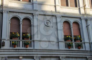 Facade of ancient building on the main tourist street (Via Quattro novembre) in centre of Rimini, Italy