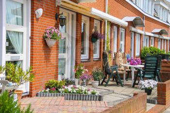 Street view of traditional house decorated with plants and furniture in Zandvoort, the Netherlands