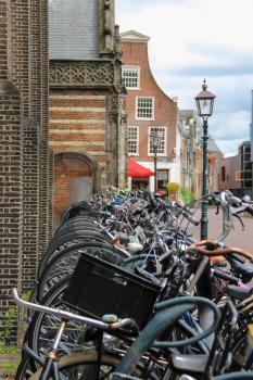 Parked bicycles on the street in the historic center of Haarlem, the Netherlands