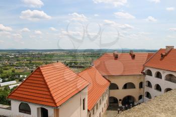 Mukachevo, Ukraine - July 2, 2014: Interior courtyard of Palanok Castle, seen with modern roofs