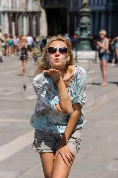 Pretty woman with long blond hair in Venice, Italy
