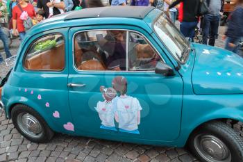 Spilamberto, Italy- October 02, 2016: Rare small car with romantic art on door