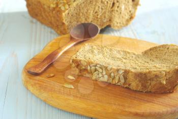 Bread slice organic natural food homemade wholegrain healthy nutrition. Tasty dieting baker meal closeup. Rustical bread on wooden desk oldstyle eating. Selective focus crust piece.