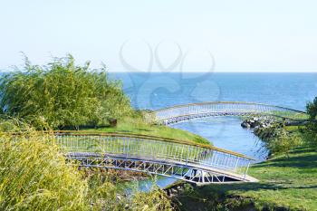 Royalty Free Photo of a Pedestrian Bridge Over a River