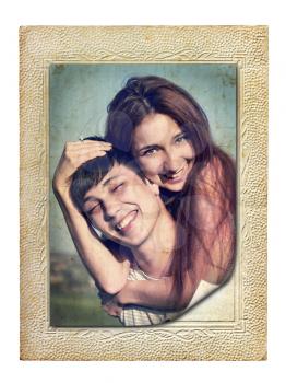 vintage picture in an old cardboard frame of a young couple in love
