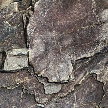 cracked stone rock in the style of grunge as background