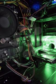 view of the internal structure of the pc with a green light from the inside