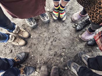 feet of people standing in a circle