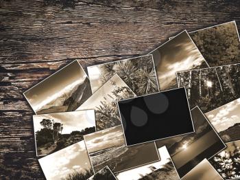 old vintage photos on a wooden background