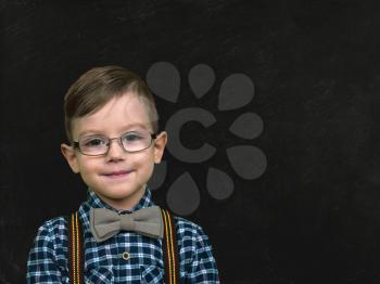 boy with glasses at the school board