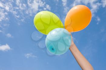Royalty Free Photo of a Person Holding Balloons