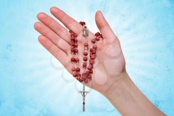 Royalty Free Photo of a Person Holding a Rosary