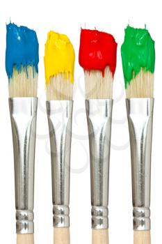 Four paintbrushes with color paints. Isolated on white background.