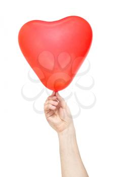Hand hold red balloon in the shape of heart. Isolated on white background