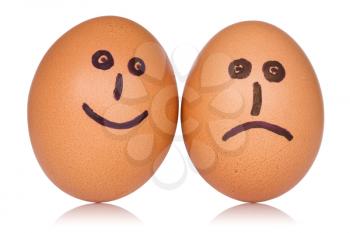  Happy and angry eggs over a white background