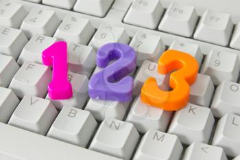 three color plastic numbers on the computer keyboard