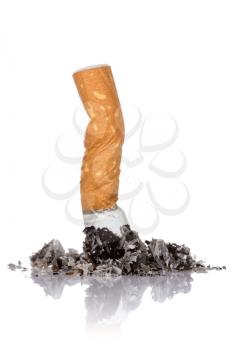 Single cigarette butt with ash over a white background	