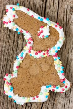 Easter bunny gingerbread cookie on the wooden background