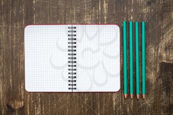 Personal organizer and four pencil.Copy-space for your text.