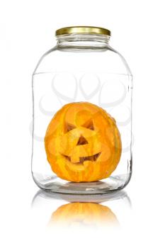  Halloween pumpkin in glass jar isolated on white background