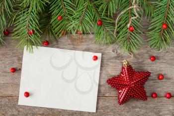 Fir branch,red berries,Christmas star and blank paper card