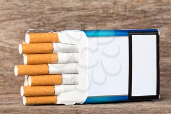 Open pack of cigarettes with cigarettes sticking out