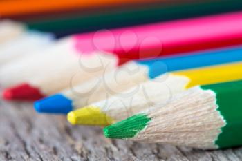 Close up view of four colored pencils. Shallow DOF.