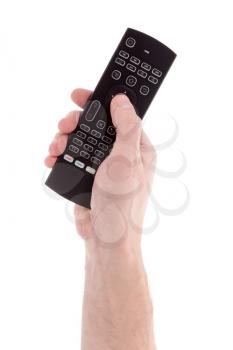 Hand holding  tv remote control. Isolated on white background.
