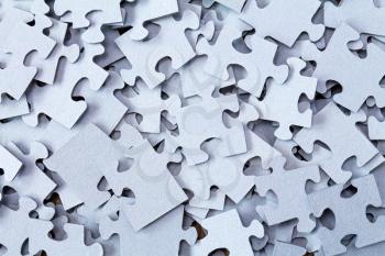 Pile of Blue Blank Puzzle Pieces Background.