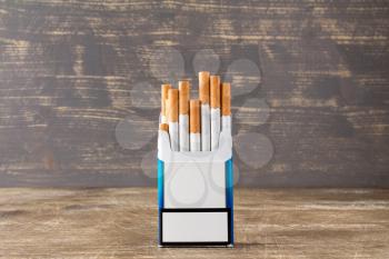 Open pack of cigarettes with cigarettes sticking out