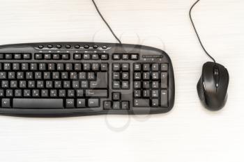 Black computer mouse and keyboard , top view