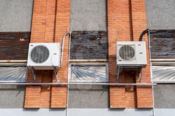 Air conditioning system installed outside on a industrial building wall