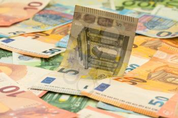 Pile of Euro banknotes scattered around