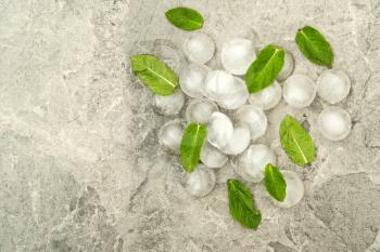 Ice pieces with fresh mint leaves, top view