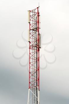 Telephone or cellphone communication pole with cloudy sky background