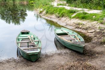 Old wooden boats on the lake 