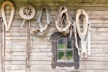 Old wooden house wall with old tools and stuff
