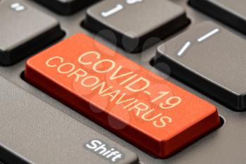 Corona Virus keyboard with a single large red key on a black computer keyboard with text -  Covid-19 Coronavirus