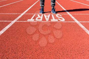 Runner feet on the starting line. New day, sport and healthy life concept