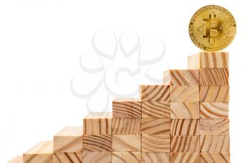 Bitcoin standing on top of wooden stairs. Bitcoin and cryptocurrency investing concept.