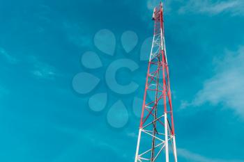 Communication tower or high speed internet signal tower with blue sky with space for text