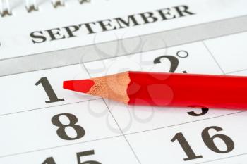 Red pencil and calendar planner for the month,  September 1th