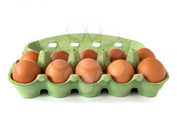 Brown chicken eggs in a green carton box isolated on white background set of ten
