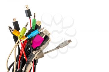 A lot of different computer cables and plugs isolated on white