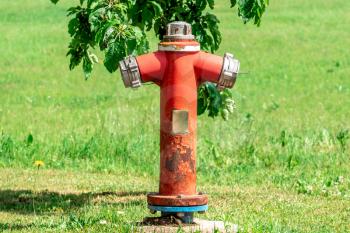 Red Fire Hydrant sits and waits to be used for the local homes