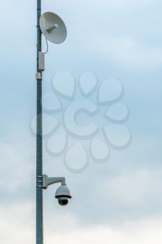 Wireless access point antenna and surveillance camera mounted on the metal pole