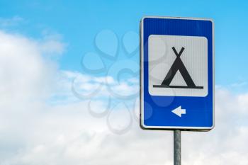 Blue road sign of camping with summer sky background