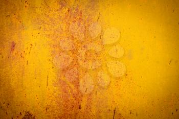 Old metal texture painted in yellow with rust and chipped.