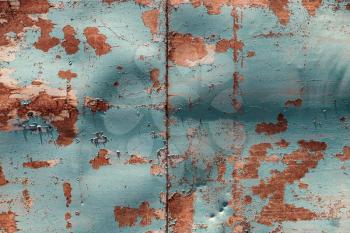 Old metal painted in blue with rust and chipped. Can be used as background.